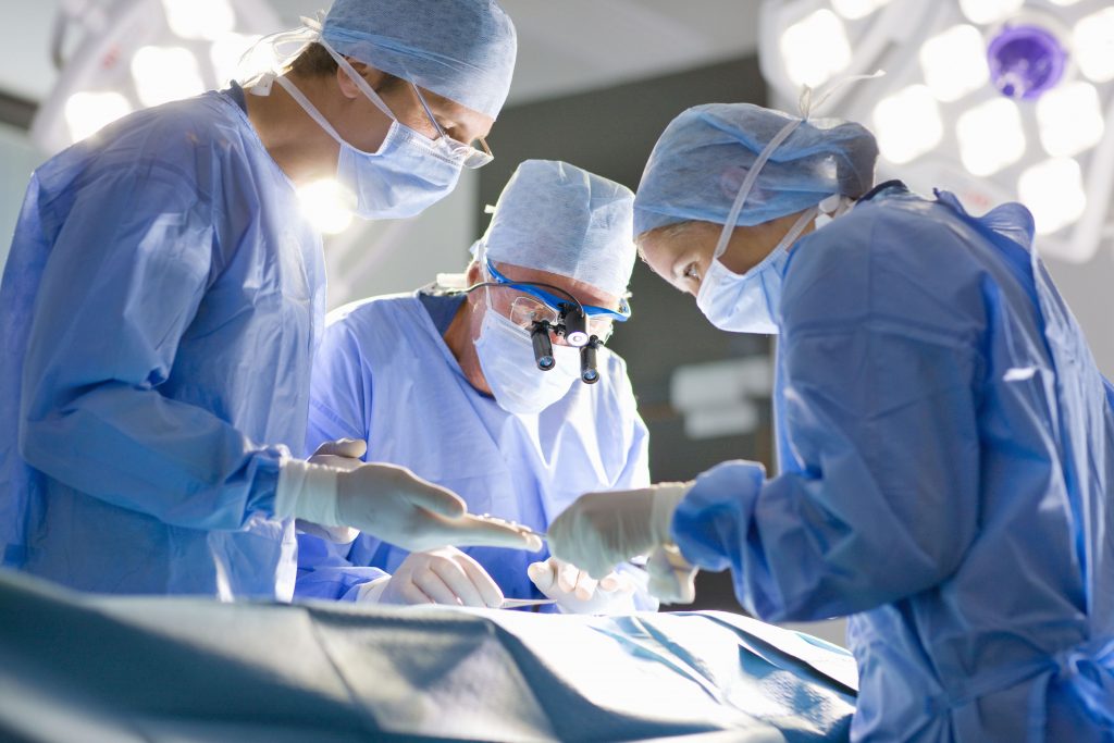 Concentrating surgeons performing operation in operating room
